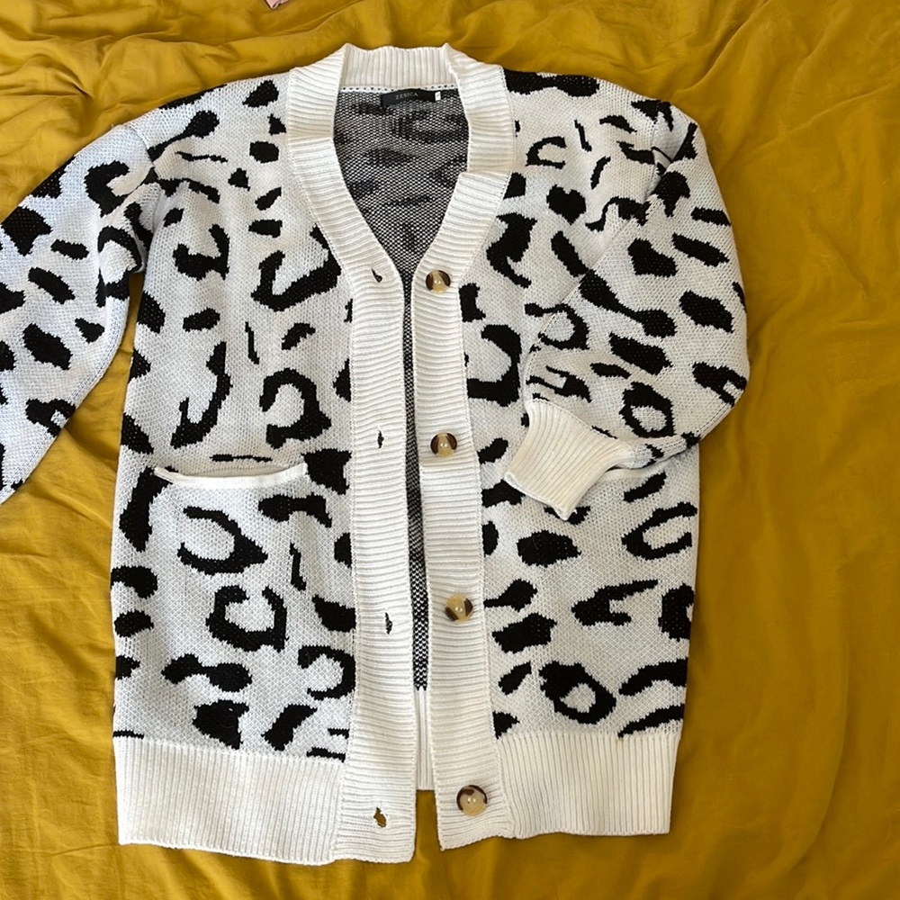 Leopard print, white and black knit cardigan.